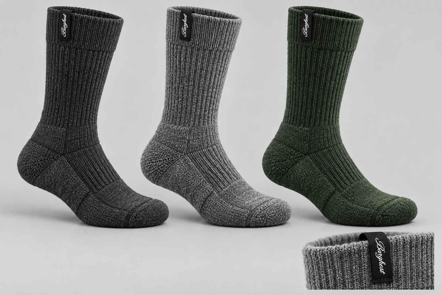 Barghest merino walking socks in charcoal, grey and green, with black labels folded over the cuff edge and white script logos